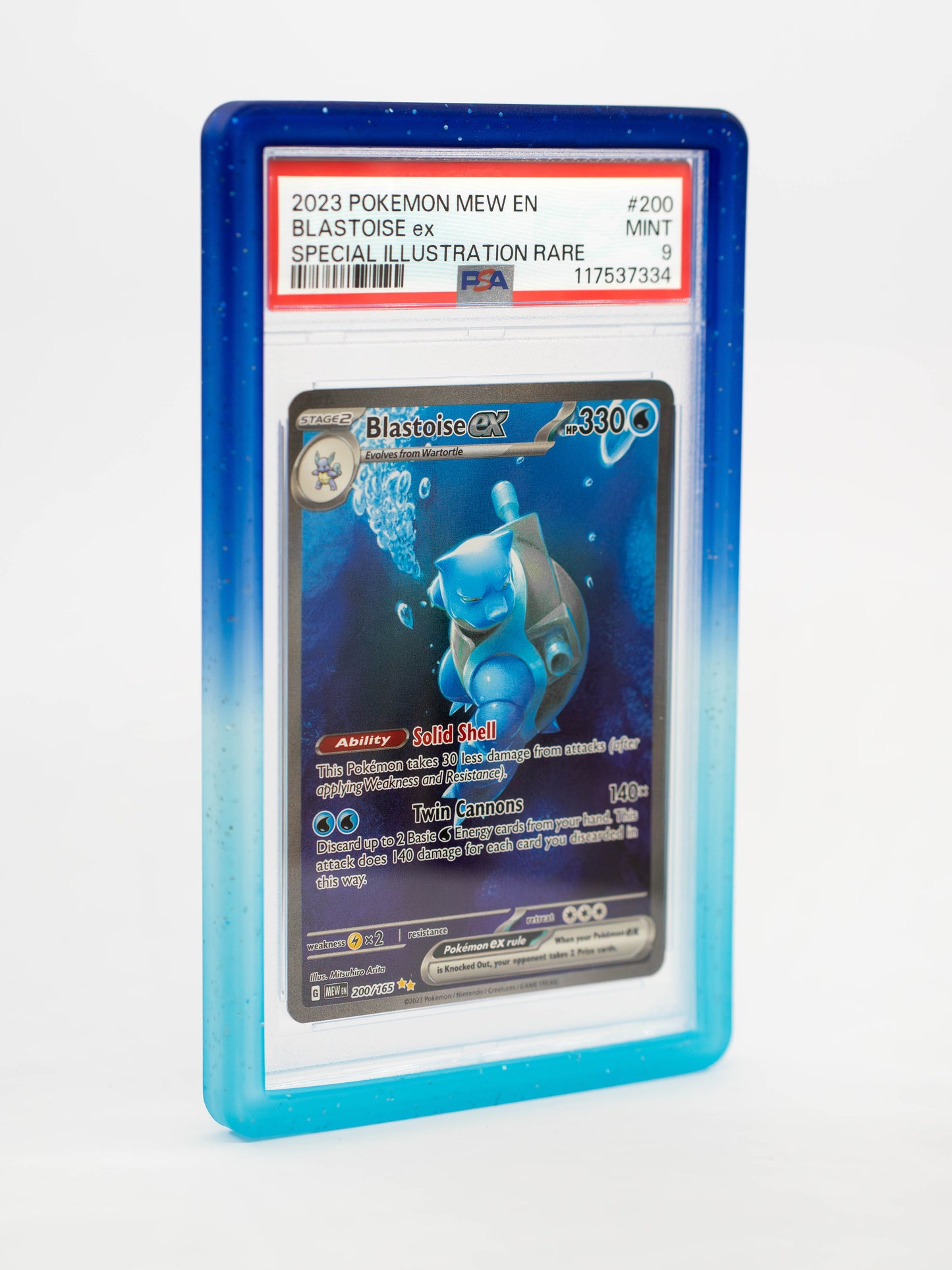 Blastoise EX trading card in a blue protective case on a white background