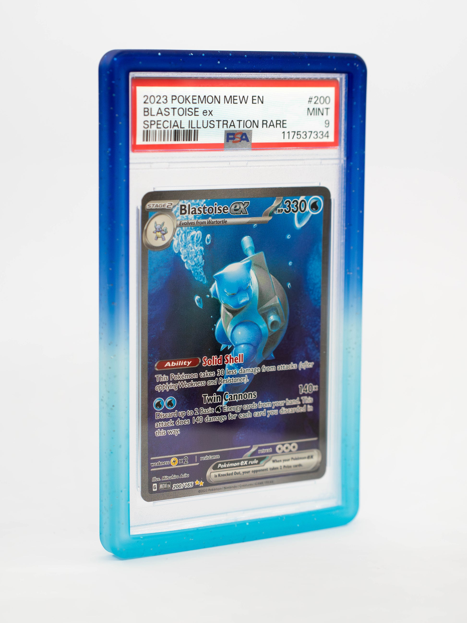 Blastoise EX trading card in a blue protective case on a white background